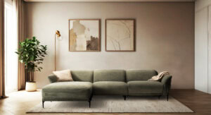 Skagen Studio Funen sofa in olive fabric, in a warm-toned living room with a plant beside it.