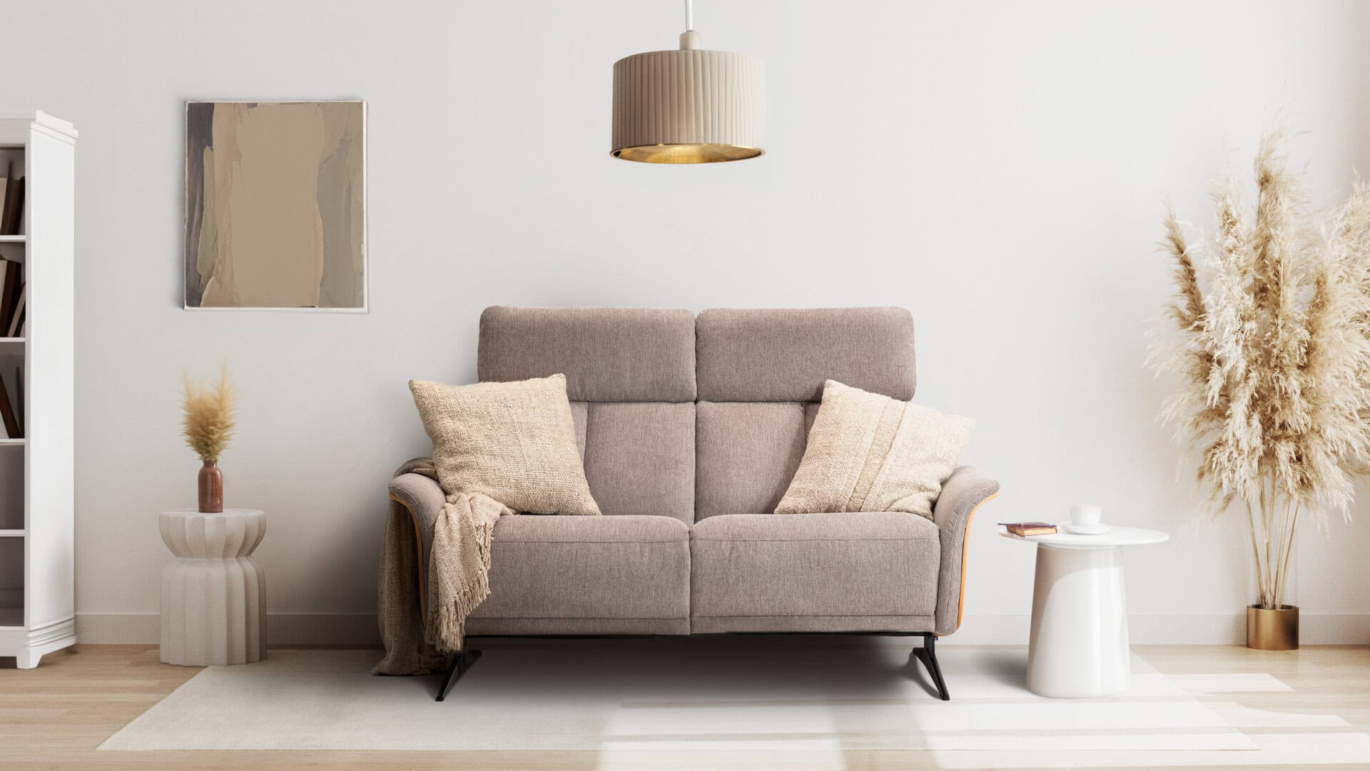 Skagen Studio Hjelm sofa in beige fabric, seen from the front in a styled room.