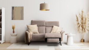 Skagen Studio Hjelm sofa in beige fabric, in a room with dried grasses.